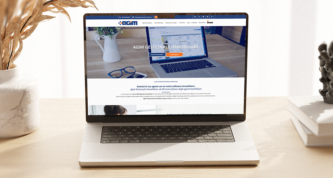 Agim — mockup del vecchio sito su laptop